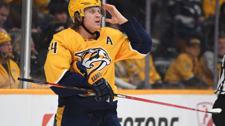 Mar 27, 2022; Nashville, Tennessee, USA; Nashville Predators center Mikael Granlund (64) looks on during the third period against the Philadelphia Flyers at Bridgestone Arena. Mandatory Credit: Christopher Hanewinckel-USA TODAY Sports