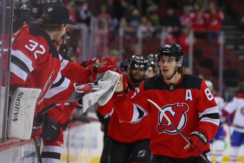 Mar 27, 2022; Newark, New Jersey, USA; New Jersey Devils center Jack Hughes (86) celebrates his goal against the Montreal Canadiens during the first period at Prudential Center. Mandatory Credit: Ed Mulholland-USA TODAY Sports