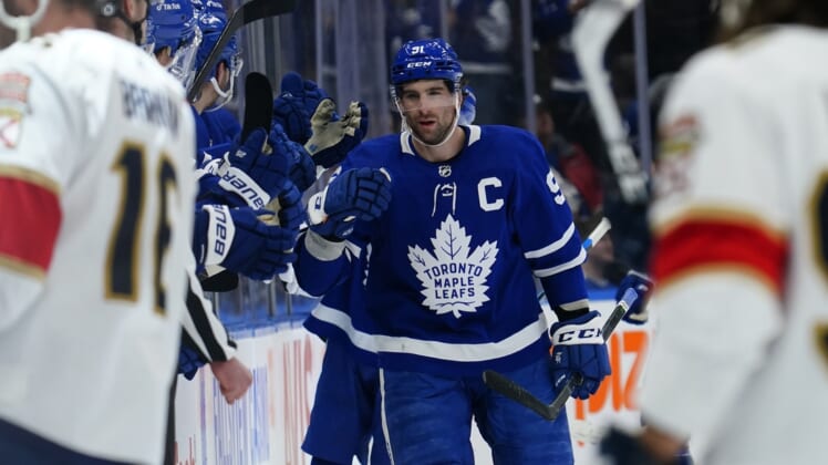Mar 27, 2022; Toronto, Ontario, CAN; Toronto Maple Leafs forward John Tavares (91) gets congratulated after scoring a goal during the second period against the Florida Panthers at Scotiabank Arena. Mandatory Credit: John E. Sokolowski-USA TODAY Sports