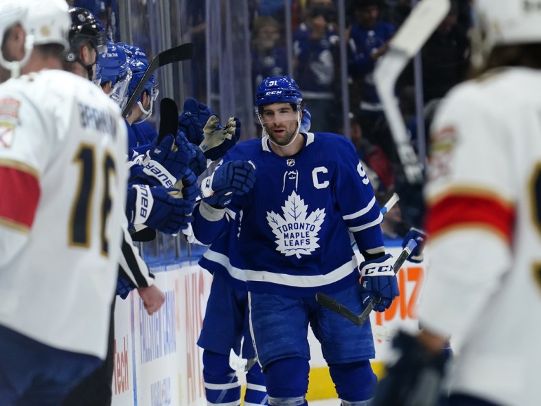 Mar 27, 2022; Toronto, Ontario, CAN; Toronto Maple Leafs forward John Tavares (91) gets congratulated after scoring a goal during the second period against the Florida Panthers at Scotiabank Arena. Mandatory Credit: John E. Sokolowski-USA TODAY Sports