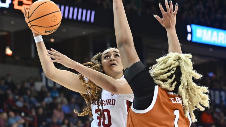 Mar 27, 2022; Spokane, WA, USA; Stanford Cardinal guard Haley Jones (30) shoots the ball against Texas Longhorns center Lauren Ebo (1) in the Spokane regional finals of the women's college basketball NCAA Tournament at Spokane Veterans Memorial Arena. Mandatory Credit: James Snook-USA TODAY Sports