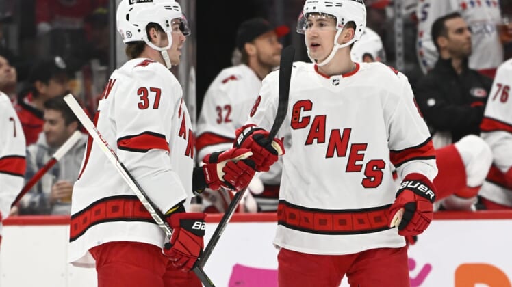 Mar 28, 2022; Washington, District of Columbia, USA; Carolina Hurricanes center Martin Necas (88) is congratulated by right wing Andrei Svechnikov (37) after scoring a goal against the Washington Capitals during the first period at Capital One Arena. Mandatory Credit: Brad Mills-USA TODAY Sports
