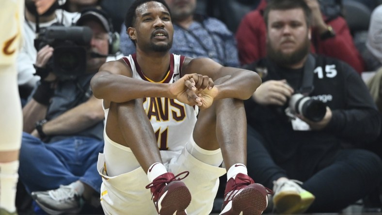 Mar 28, 2022; Cleveland, Ohio, USA; Cleveland Cavaliers center Evan Mobley (4) reacts after he was knocked to the floor in the second quarter against the Orlando Magic at Rocket Mortgage FieldHouse. Mandatory Credit: David Richard-USA TODAY Sports