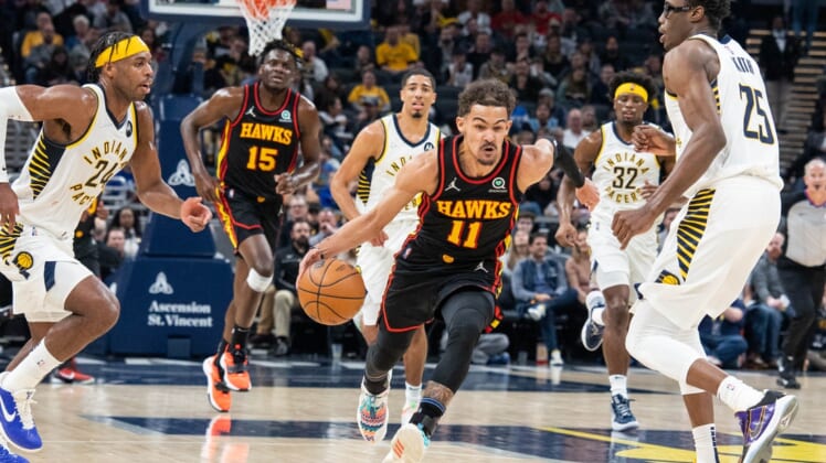 Mar 28, 2022; Indianapolis, Indiana, USA; Atlanta Hawks guard Trae Young (11) dribbles the ball in the first half against the Indiana Pacers at Gainbridge Fieldhouse. Mandatory Credit: Trevor Ruszkowski-USA TODAY Sports