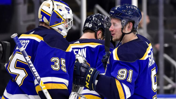 Mar 28, 2022; St. Louis, Missouri, USA;  St. Louis Blues right wing Vladimir Tarasenko (91) celebrates with goaltender Ville Husso (35) after the Blues defeated the Vancouver Canucks at Enterprise Center. Mandatory Credit: Jeff Curry-USA TODAY Sports