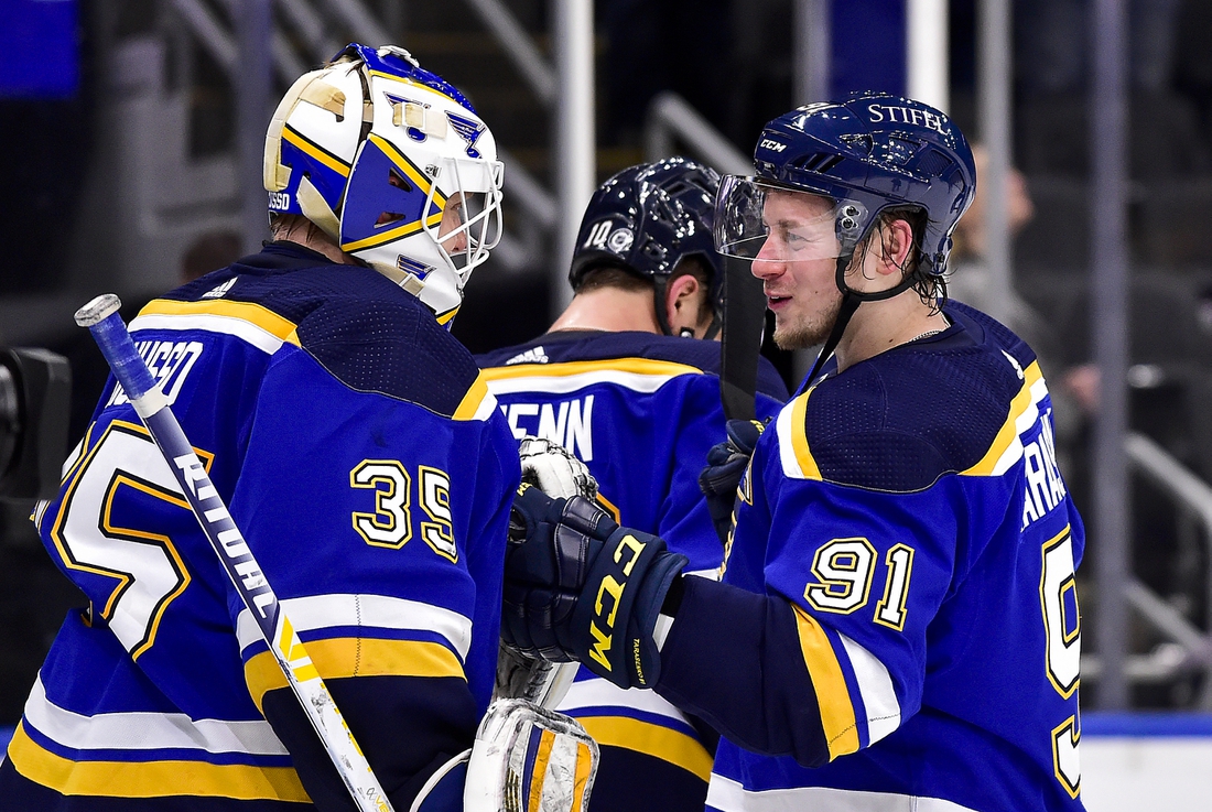 Mar 28, 2022; St. Louis, Missouri, USA;  St. Louis Blues right wing Vladimir Tarasenko (91) celebrates with goaltender Ville Husso (35) after the Blues defeated the Vancouver Canucks at Enterprise Center. Mandatory Credit: Jeff Curry-USA TODAY Sports