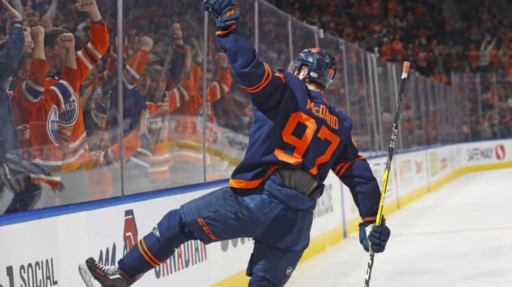 Mar 28, 2022; Edmonton, Alberta, CAN; Edmonton Oilers forward Connor McDavid (97) celebrates his first period goal against the Arizona Coyotes at Rogers Place. Mandatory Credit: Perry Nelson-USA TODAY Sports