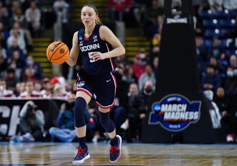 Mar 28, 2022; Bridgeport, CT, USA; UConn Huskies guard Paige Bueckers (5) returns the ball against the NC State Wolfpack during the second half in the Bridgeport regional finals of the women's college basketball NCAA Tournament at Webster Bank Arena. Mandatory Credit: David Butler II-USA TODAY Sports