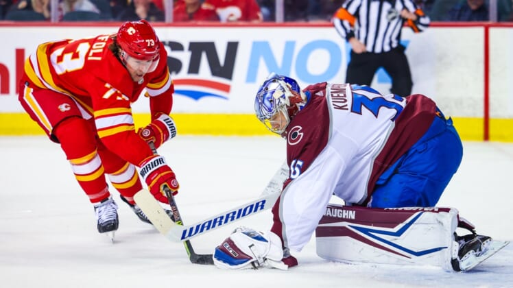 Mar 29, 2022; Calgary, Alberta, CAN; Colorado Avalanche goaltender Darcy Kuemper (35) makes a save against Calgary Flames right wing Tyler Toffoli (73) during the first period at Scotiabank Saddledome. Mandatory Credit: Sergei Belski-USA TODAY Sports