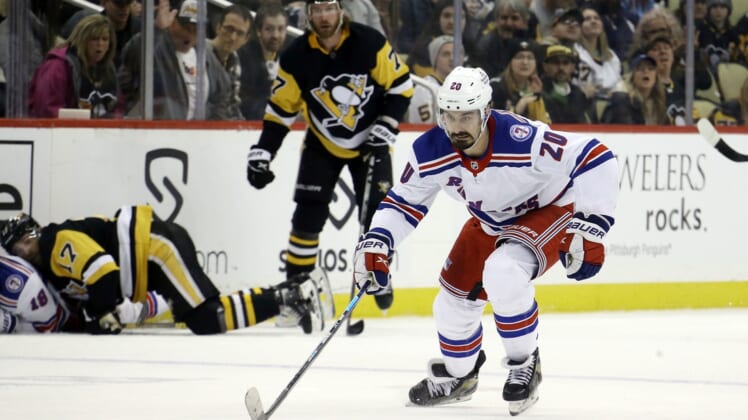Mar 29, 2022; Pittsburgh, Pennsylvania, USA;  New York Rangers left wing Chris Kreider (20) skates up ice with the puck against the Pittsburgh Penguins during the third period at PPG Paints Arena. The Rangers won 3-2. Mandatory Credit: Charles LeClaire-USA TODAY Sports