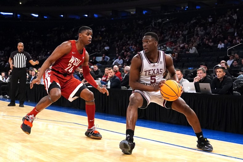 Mar 29, 2022; New York, New York, USA; Texas A&M Aggies guard Hassan Diarra (5) looks to make a move against Washington State Cougars guard Noah Williams (24) during the first half of the NIT college basketball semifinals at Madison Square Garden. Mandatory Credit: Gregory Fisher-USA TODAY Sports