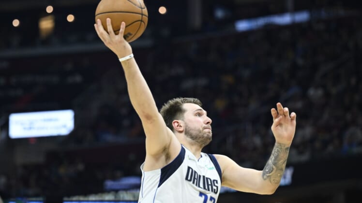 Mar 30, 2022; Cleveland, Ohio, USA; Dallas Mavericks guard Luka Doncic (77) drives to the basket in the second quarter against the Cleveland Cavaliers at Rocket Mortgage FieldHouse. Mandatory Credit: David Richard-USA TODAY Sports