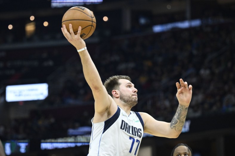 Mar 30, 2022; Cleveland, Ohio, USA; Dallas Mavericks guard Luka Doncic (77) drives to the basket in the second quarter against the Cleveland Cavaliers at Rocket Mortgage FieldHouse. Mandatory Credit: David Richard-USA TODAY Sports