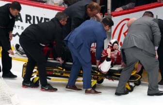 Mar 30, 2022; Glendale, Arizona, USA; Arizona Coyotes trainers and medical staff cart Arizona Coyotes right wing Clayton Keller (9) off the ice during the third period against the San Jose Sharks at Gila River Arena. Mandatory Credit: Mark J. Rebilas-USA TODAY Sports