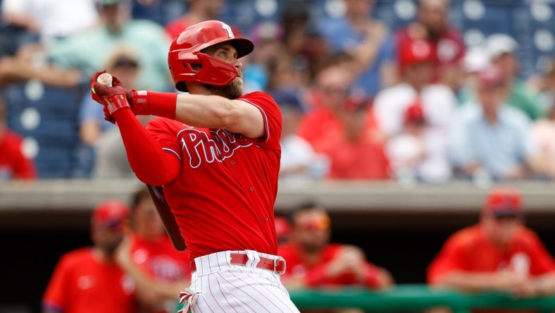 Mar 31, 2022; Clearwater, Florida, USA; Philadelphia Phillies right fielder Bryce Harper (3)  hits a two run home run against the New York Yankees in the fifth inning during spring training at BayCare Ballpark. Mandatory Credit: Nathan Ray Seebeck-USA TODAY Sports