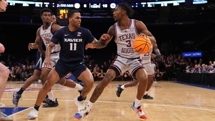 Mar 31, 2022; New York, New York, USA; Texas A&M Aggies guard Quenton Jackson (3) dribbles the ball against Xavier Musketeers guard Dwon Odom (11) during the first half of the NIT college basketball finals at Madison Square Garden. Mandatory Credit: Gregory Fisher-USA TODAY Sports