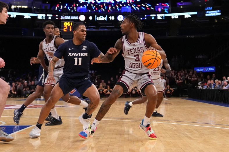 Mar 31, 2022; New York, New York, USA; Texas A&M Aggies guard Quenton Jackson (3) dribbles the ball against Xavier Musketeers guard Dwon Odom (11) during the first half of the NIT college basketball finals at Madison Square Garden. Mandatory Credit: Gregory Fisher-USA TODAY Sports
