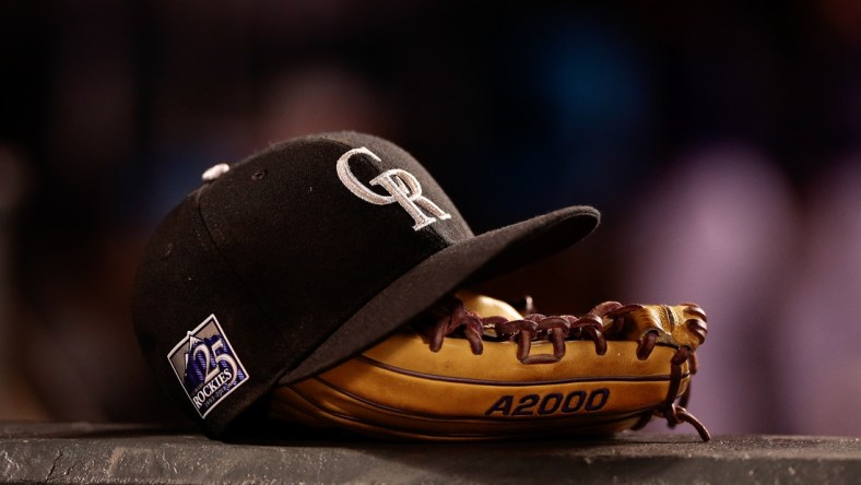 May 10, 2018; Denver, CO, USA; A detail view of a Colorado Rockies players hat and glove in the fifth inning against the Milwaukee Brewers at Coors Field. Mandatory Credit: Isaiah J. Downing-USA TODAY Sports