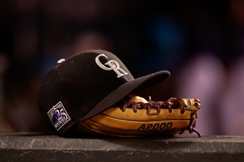 May 10, 2018; Denver, CO, USA; A detail view of a Colorado Rockies players hat and glove in the fifth inning against the Milwaukee Brewers at Coors Field. Mandatory Credit: Isaiah J. Downing-USA TODAY Sports
