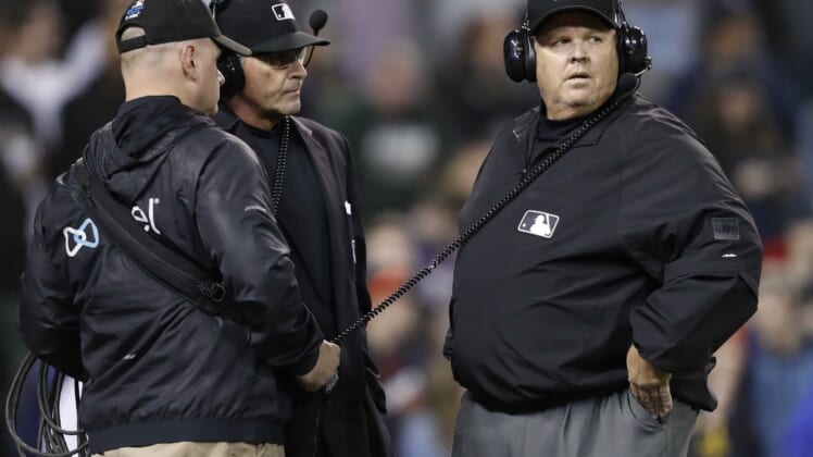 May 21, 2019; Detroit, MI, USA; MLB umpire Fieldin Culbreth (right) looks on during a replay review during the ninth inning in the game between the Detroit Tigers and the Miami Marlins at Comerica Park. Mandatory Credit: Raj Mehta-USA TODAY Sports
