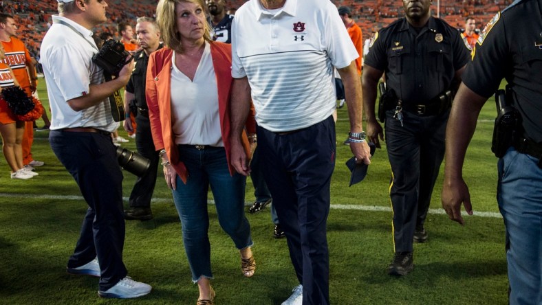 Auburn head coach Gus Malzahn and his wife, Kristi, walk of the field at Jordan-Hare Stadium in Auburn, Ala., on Saturday, Sept. 28, 2019. Auburn defeated Mississippi State 56-23.

Jc Auburnmissstate 73