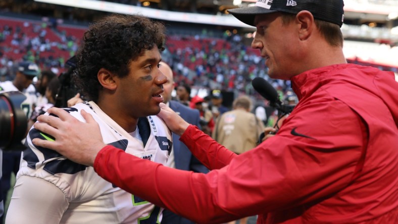 Oct 27, 2019; Atlanta, GA, USA; Seattle Seahawks quarterback Russell Wilson (3) talks with Atlanta Falcons quarterback Matt Ryan (right) after a game at Mercedes-Benz Stadium. Mandatory Credit: Jason Getz-USA TODAY Sports