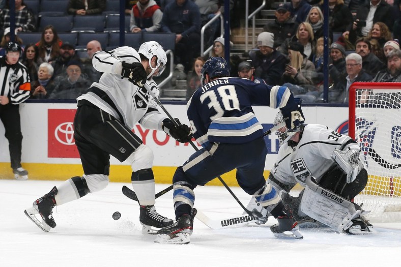 Dec 19, 2019; Columbus, OH, USA; Columbus Blue Jackets center Boone Jenner (38) and Los Angeles Kings center Anze Kopitar (11) battle for the puck during the third period at Nationwide Arena. Mandatory Credit: Russell LaBounty-USA TODAY Sports