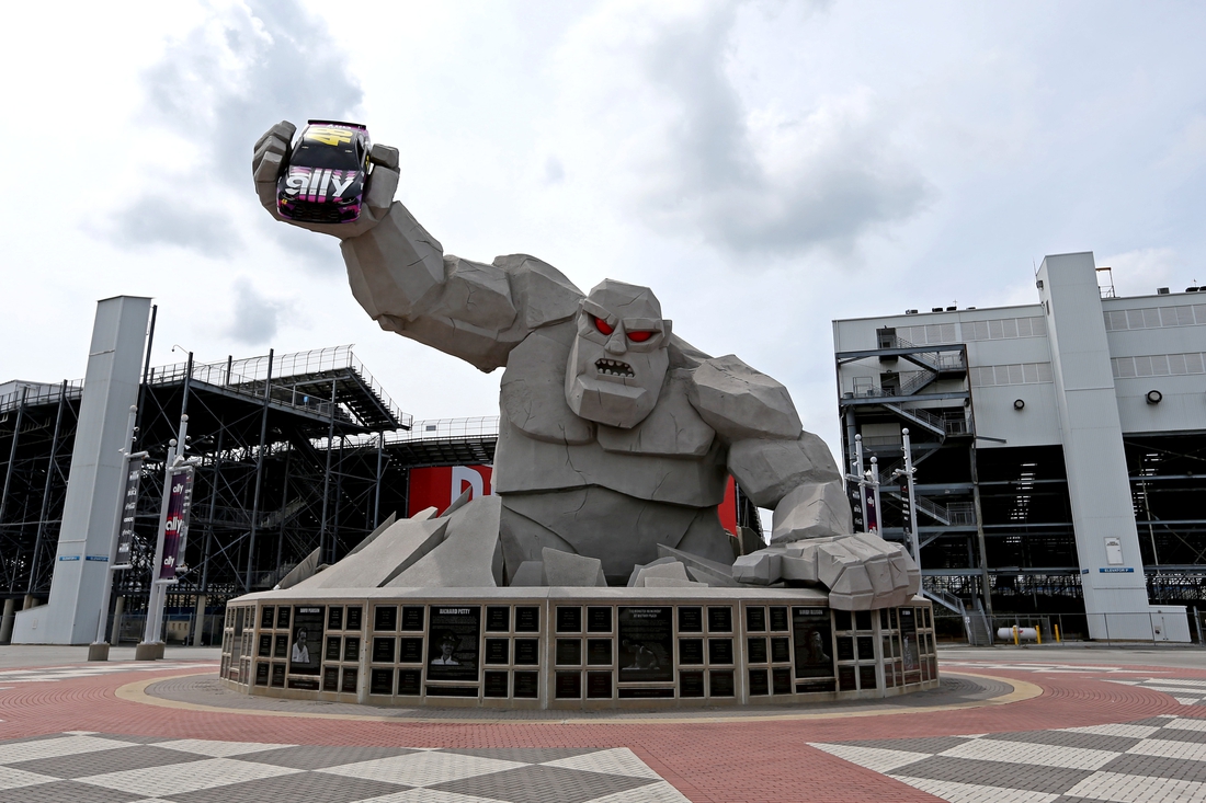 Aug 22, 2020; Dover, Delaware, USA; The statue of "Miles the Monster" out of Dover International Speedway hold a car of NASCAR Cup Series driver Jimmie Johnson (not pictured) before the NASCAR Cup Series race. Mandatory Credit: Peter Casey-USA TODAY Sports