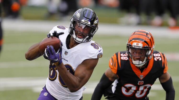 Jan 3, 2021; Cincinnati, Ohio, USA; Baltimore Ravens wide receiver Miles Boykin (80) makes the touchdown catch as he defended by Cincinnati Bengals cornerback LeShaun Sims (38) during the first quarter at Paul Brown Stadium. Mandatory Credit: Joseph Maiorana-USA TODAY Sports