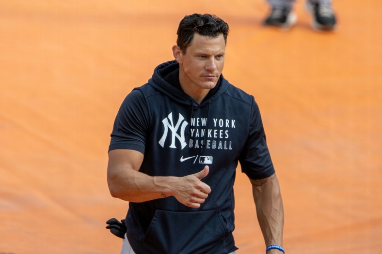 Mar 20, 2021; Sarasota, Florida, USA;  New York Yankees first baseman Derek Dietrich (12) walks off the field after batting practice during spring training at Ed Smith Stadium. Mandatory Credit: Nathan Ray Seebeck-USA TODAY Sports