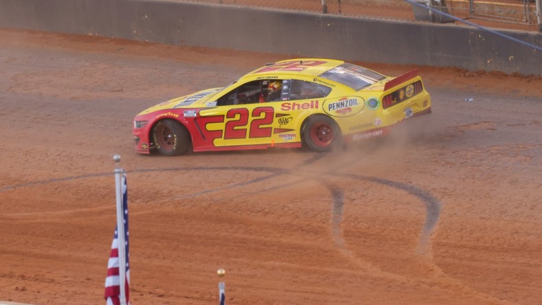 Mar 29, 2021; Bristol, TN, USA; NASCAR Cup Series driver Joey Logano (22) wins the Food City Dirt Race at Bristol Motor Speedway. Mandatory Credit: Randy Sartin-USA TODAY Sports