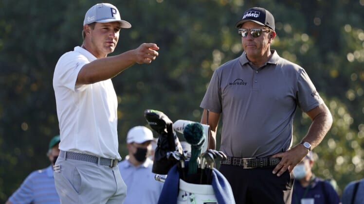 Apr 7, 2021; Augusta, GA, USA; Bryson DeChambeau (left) and Phil Mickelson (right) on the 10th tee during a practice round for The Masters golf tournament at Augusta National Golf Club. Mandatory Credit: Michael Madrid-USA TODAY Sports