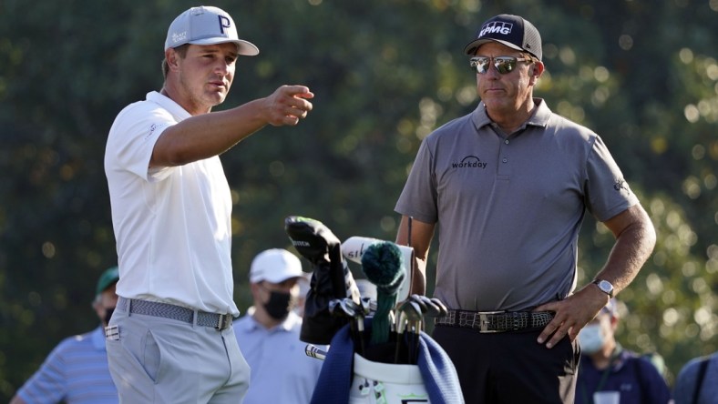 Apr 7, 2021; Augusta, GA, USA; Bryson DeChambeau (left) and Phil Mickelson (right) on the 10th tee during a practice round for The Masters golf tournament at Augusta National Golf Club. Mandatory Credit: Michael Madrid-USA TODAY Sports