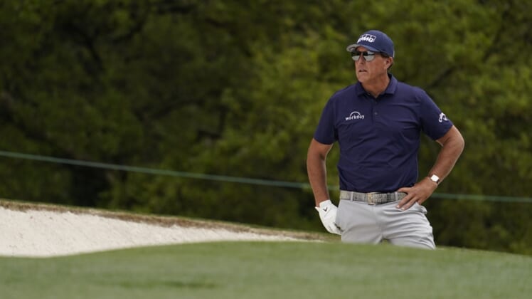 Apr 8, 2021; Augusta, Georgia, USA; Phil Mickelson looks out from a bunker on the 1st hole during the first round of The Masters golf tournament. Mandatory Credit: Rob Schumacher-USA TODAY Sports