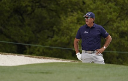 Apr 8, 2021; Augusta, Georgia, USA; Phil Mickelson looks out from a bunker on the 1st hole during the first round of The Masters golf tournament. Mandatory Credit: Rob Schumacher-USA TODAY Sports