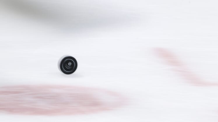 Apr 10, 2021; Columbus, Ohio, USA; A view of the NHL logo on an official game puck as it rolls across the ice during a stop in play in the game between the Chicago Blackhawks and the Columbus Blue Jackets in the first period at Nationwide Arena. Mandatory Credit: Aaron Doster-USA TODAY Sports