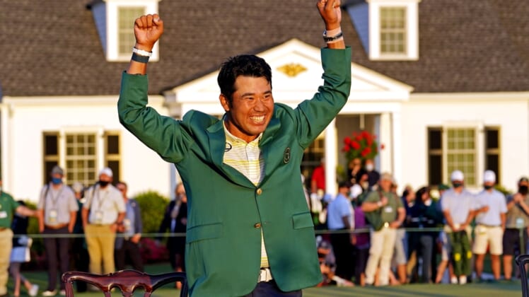 Apr 11, 2021; Augusta, Georgia, USA; Hideki Matsuyama celebrates with the green jacket after winning The Masters golf tournament. Mandatory Credit: Rob Schumacher-USA TODAY Sports