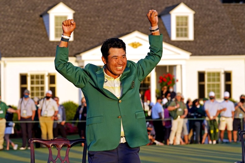 Apr 11, 2021; Augusta, Georgia, USA; Hideki Matsuyama celebrates with the green jacket after winning The Masters golf tournament. Mandatory Credit: Rob Schumacher-USA TODAY Sports