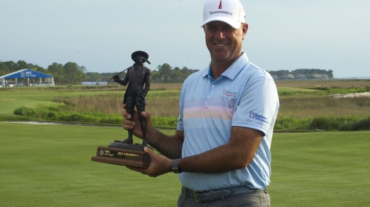 Apr 18, 2021; Hilton Head, South Carolina, USA; Stewart Cink poses with the trophy after winning the 2021 RBC Heritage golf tournament. Mandatory Credit: Joshua S. Kelly-USA TODAY Sports