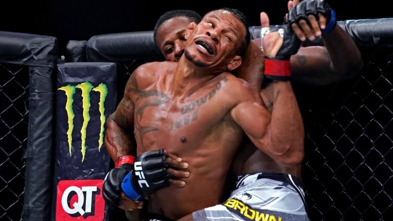 Apr 24, 2021; Jacksonville, Florida, USA; Alex Oliveira (Red Gloves) fights Randy Brown (Blue Gloves) during UFC 261 at VyStar Veterans Memorial Arena. Mandatory Credit: Jasen Vinlove-USA TODAY Sports