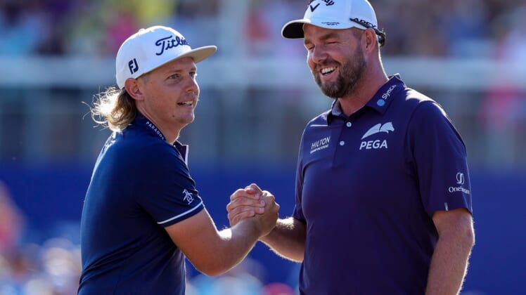 Apr 25, 2021; Avondale, Louisiana, USA; Cameron Smith shakes hands with Marc Leishman after winning the final round round of the Zurich Classic of New Orleans golf tournament. Mandatory Credit: Stephen Lew-USA TODAY Sports