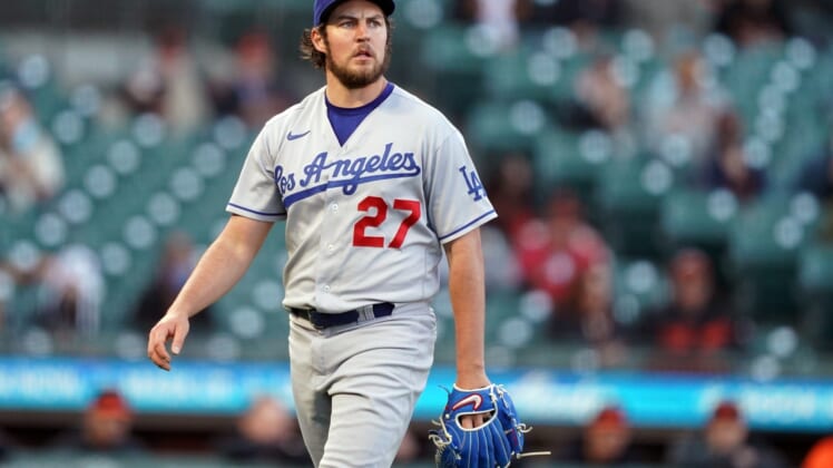 May 21, 2021; San Francisco, California, USA; Los Angeles Dodgers starting pitcher Trevor Bauer (27) walks to the dugout at the end of the first inning against the San Francisco Giants at Oracle Park. Mandatory Credit: Darren Yamashita-USA TODAY Sports