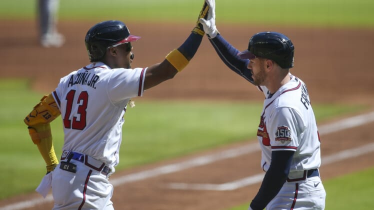 May 22, 2021; Atlanta, Georgia, USA; Atlanta Braves right fielder Ronald Acuna Jr. (13) celebrates after a home run with first baseman Freddie Freeman (5) against the Pittsburgh Pirates in the first inning at Truist Park. Mandatory Credit: Brett Davis-USA TODAY Sports