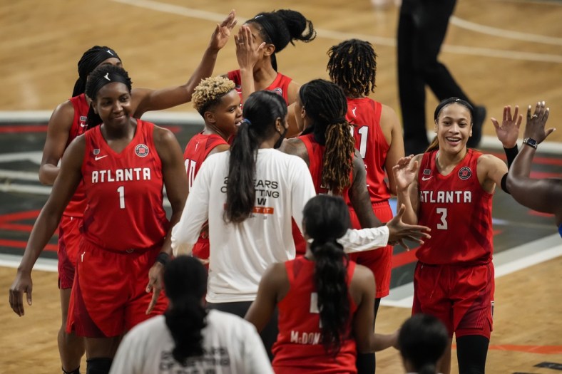 May 27, 2021; College Park, Georgia, USA; Atlanta Dream players react after defeating the Dallas Wings at Gateway Center Arena at College Park. Mandatory Credit: Dale Zanine-USA TODAY Sports
