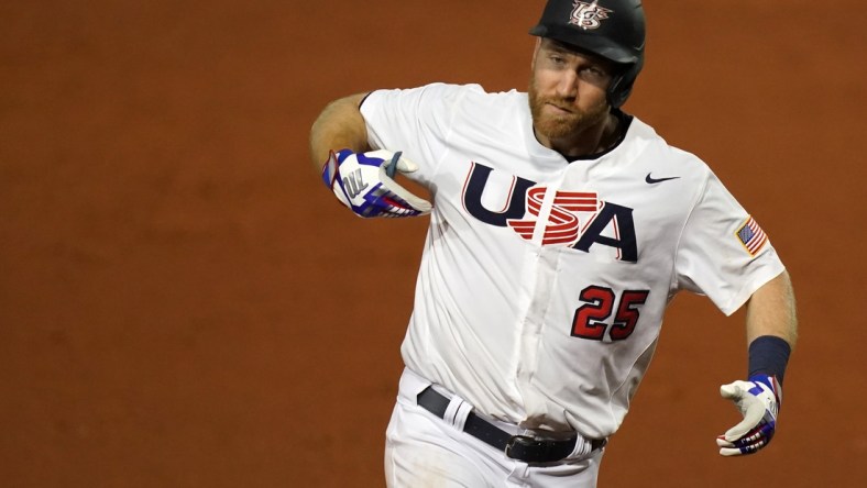 Jun 5, 2021; Port St. Lucie, Florida, USA; USA third baseman Todd Frazier (25) points to his chest while he rounds the bases after hitting a solo homerun in the 7th inning against Venezuela in the Super Round of the WBSC Baseball Americas Qualifier series at Clover Park. Mandatory Credit: Jasen Vinlove-USA TODAY Sports