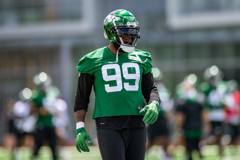 May 27, 2021; Florham Park, NJ, USA; New York Jets defensive end Vinny Curry (99) participates in a drill during an OTA at Jets Atlantic Health Training Center. Mandatory Credit: John Jones-USA TODAY Sports