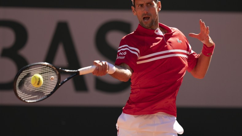 Jun 13, 2021; Paris, France; Novak Djokovic (SRB) in action during the men's final against Stefanos Tsitsipas (GRE) on day 15 of the French Open at Stade Roland Garros. Mandatory Credit: Susan Mullane-USA TODAY Sports