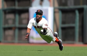 Jul 5, 2021; San Francisco, California, USA; San Francisco Giants right fielder Jaylin Davis (49) makes a diving catch during the fifth inning against the St. Louis Cardinals at Oracle Park. Mandatory Credit: Sergio Estrada-USA TODAY Sports