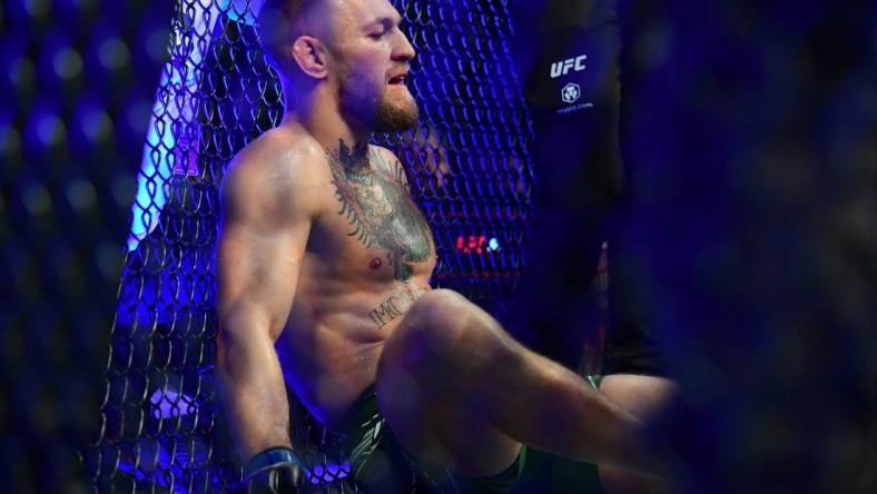 Jul 10, 2021; Las Vegas, Nevada, USA; Conor McGregor reacts following an injury suffered against Dustin Poirier during UFC 264 at T-Mobile Arena. Mandatory Credit: Gary A. Vasquez-USA TODAY Sports