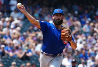Aug 5, 2021; Denver, Colorado, USA; Chicago Cubs starting pitcher Jake Arrieta (49) throws to first base against the Colorado Rockies in the first inning at Coors Field. Mandatory Credit: Ron Chenoy-USA TODAY Sports
